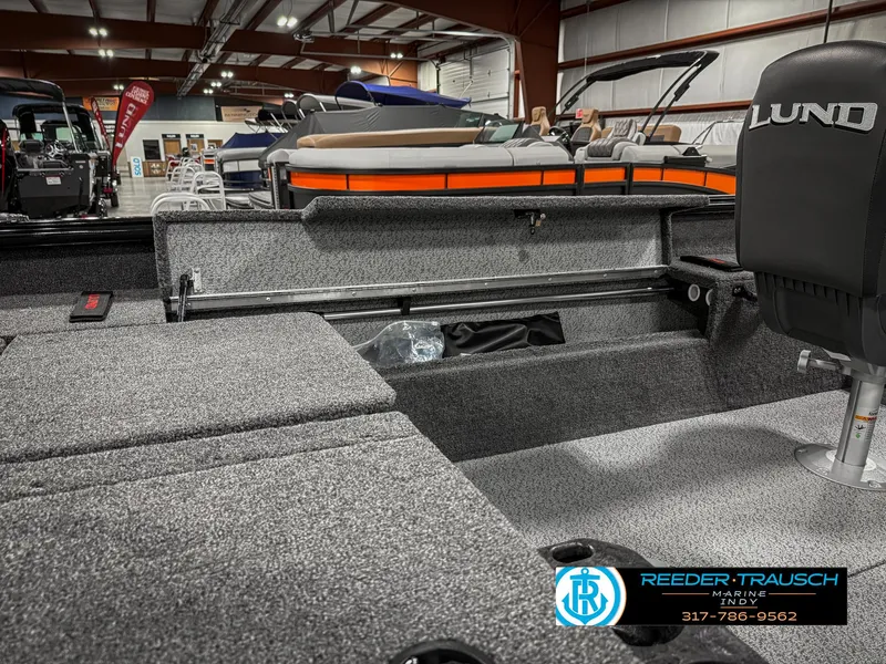 Slide: The Image of 2025 Lund 1775 Impact XS Single boat interior at Reeder-Trausch Marine showroom. - 27