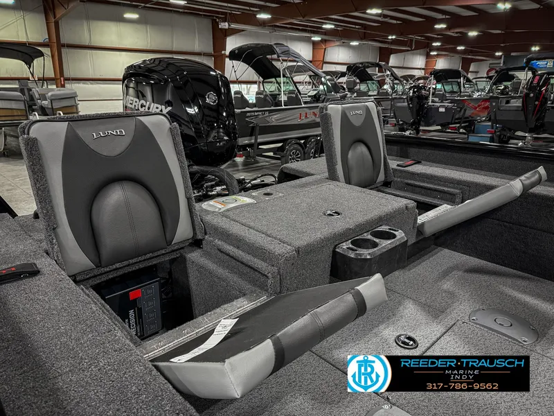 Slide: The Image of 2025 Lund 1775 Impact XS Single boat interior with seating and storage compartments. - 32