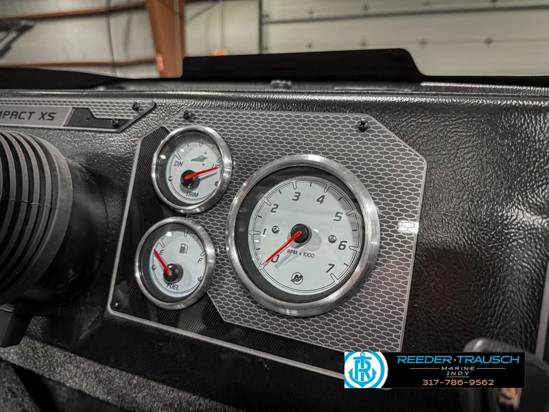 Slide: The Image of Dashboard of 2025 Lund 1775 IMPACT XS boat with gauges and branding. - 39
