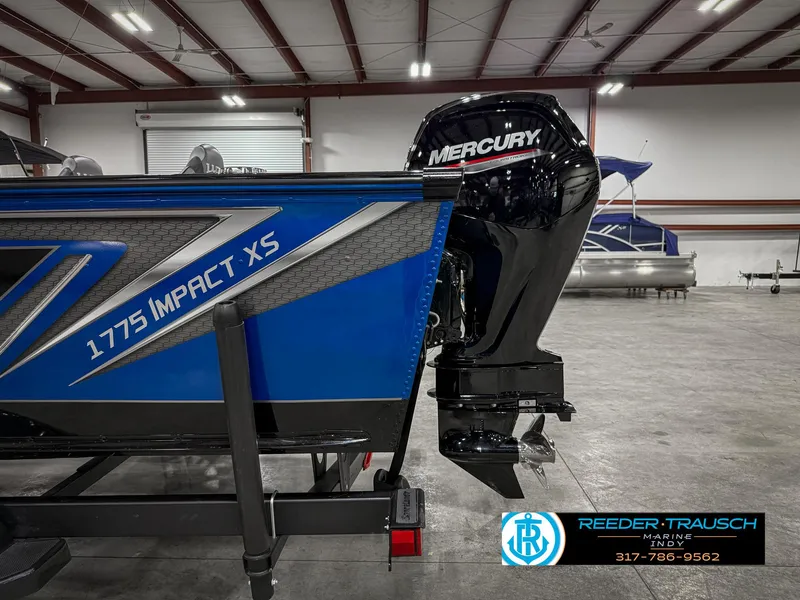 Slide: The Image of 2025 Lund 1775 Impact XS boat with Mercury engine in showroom. - 47
