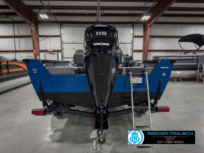 Slide: The Image of 2025 Lund 1775 IMPACT XS SINGLE boat with Mercury 115 engine in showroom. - 7
