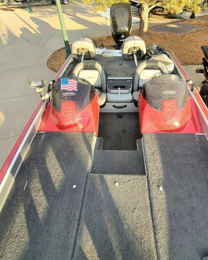 Slide: The Image of 2007 Legend Alpha 199 boat with red accents and American flag decal. - 4