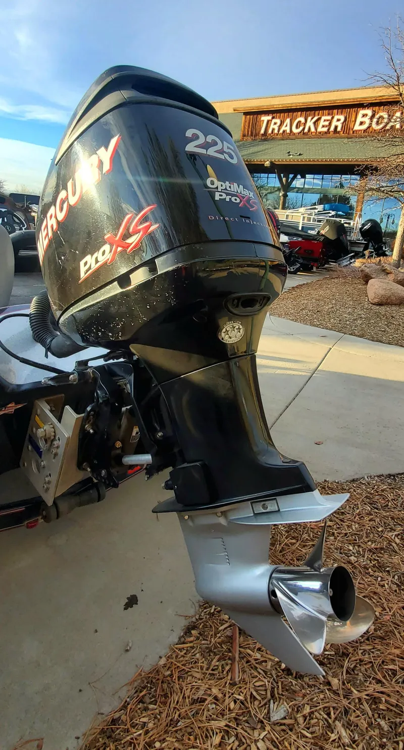 Slide: The Image of Mercury Pro XS outboard motor on Legend Alpha 199, 2007 model, at Tracker Boats dealership. - 5