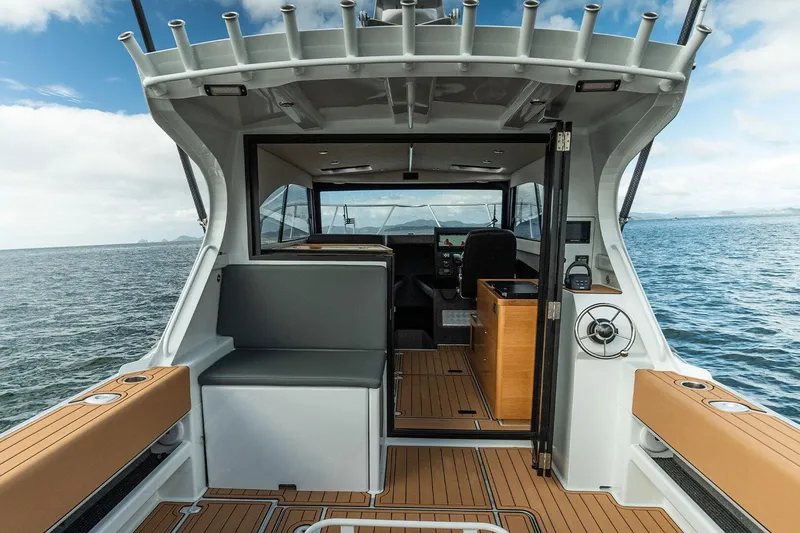 Slide: The Image of 2025 Makaira Gen3 1000 boat interior with seating and ocean view. - 3