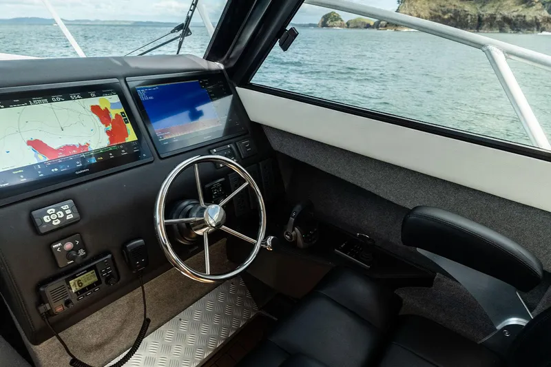 Slide: The Image of Interior of 2025 Makaira Gen3 1000 boat with navigation system and steering wheel. - 6