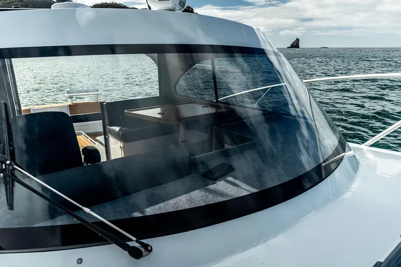 Slide: The Image of Makaira Gen3 1000 boat, 2025 model, on calm sea with interior view. - 7