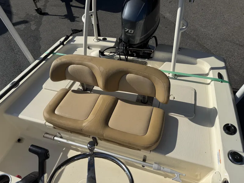 Slide: The Image of 2020 Scout 177 Sport boat interior with tan seating and Yamaha 70 outboard motor. - 4