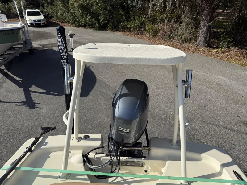 Slide: The Image of 2020 Scout 177 Sport boat with Yamaha 70 outboard motor, parked outdoors. - 5