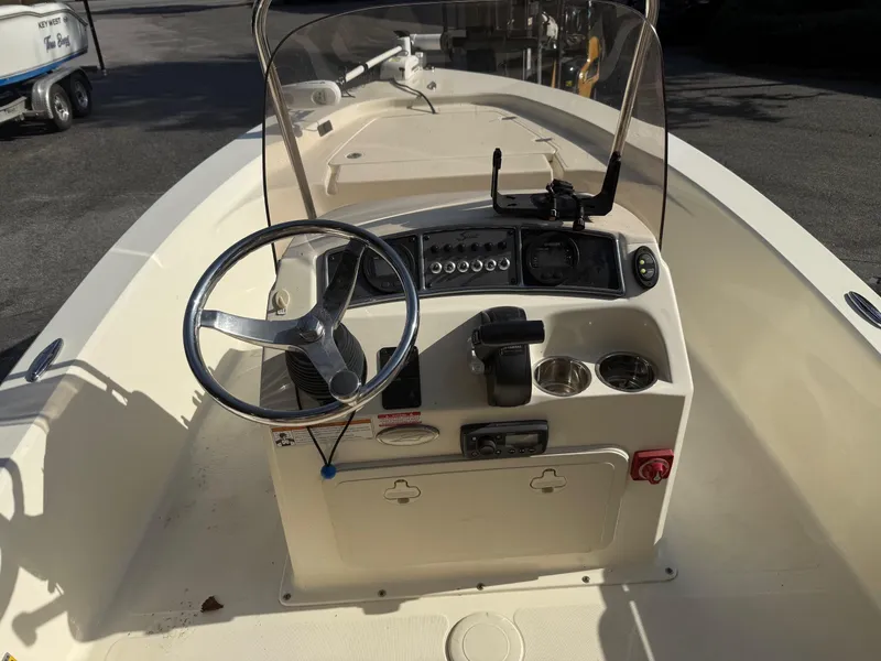 Slide: The Image of 2020 Scout 177 Sport boat dashboard with steering wheel and controls. - 6