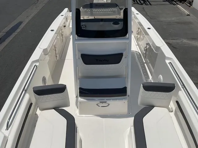 Slide: The Image of 2025 Bayliner Trophy T24CC boat interior with seating and console. - 14