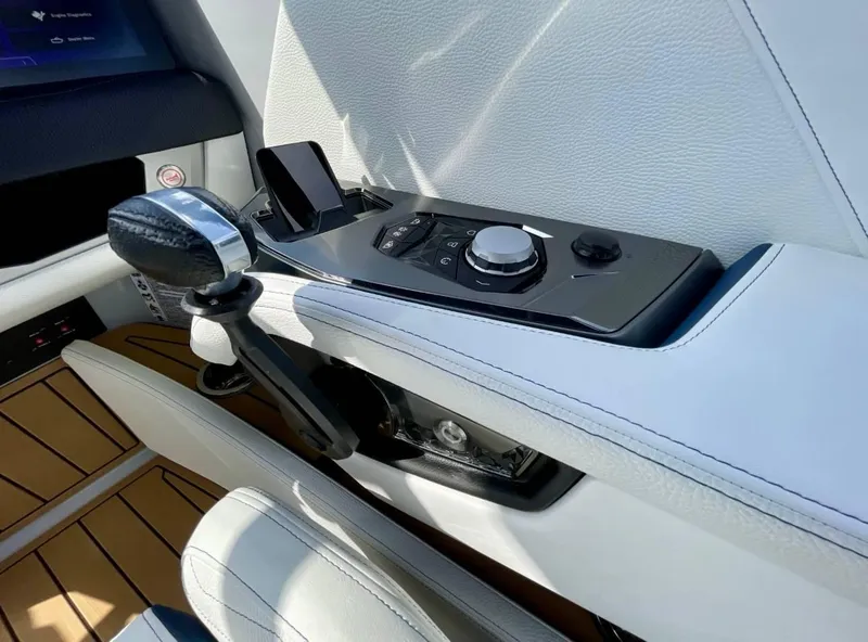 Slide: The Image of 2025 Nautique G23 interior control panel with sleek design and modern features. - 12