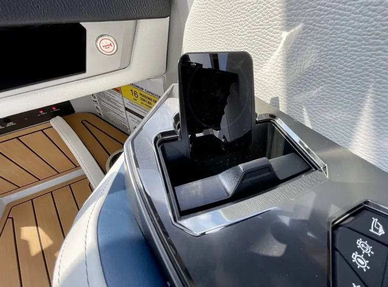 Slide: The Image of 2025 Nautique G23 interior detail with modern dashboard and sleek design elements. - 13