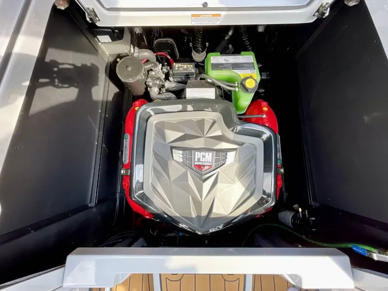 Slide: The Image of 2025 Nautique G23 engine compartment with PCM engine, showcasing modern design and components. - 25