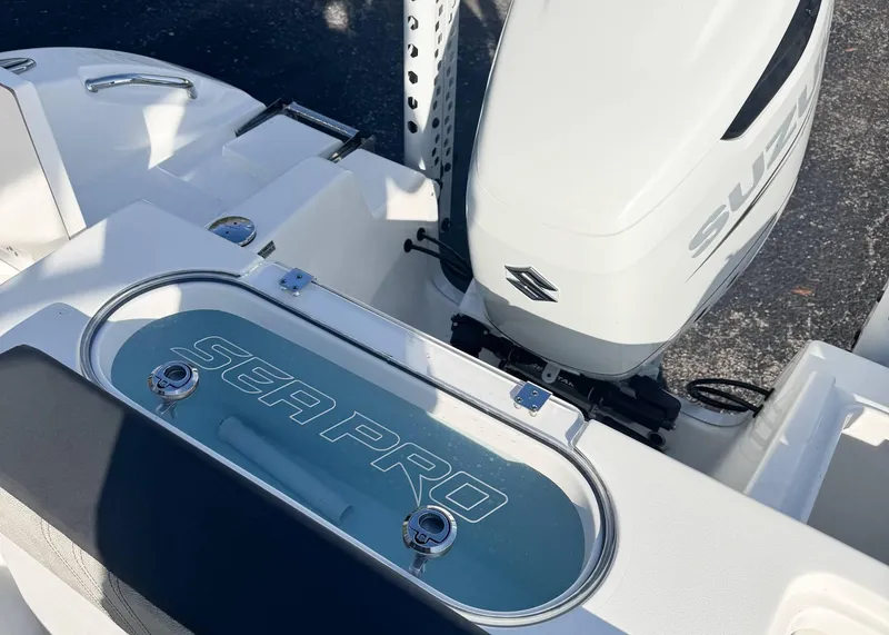 Slide: The Image of 2023 Sea Pro 240 DC boat with Suzuki outboard motor, featuring a sleek design. - 8