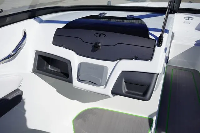 Slide: The Image of 2024 Tahoe 210 S boat interior with sleek dashboard design and storage compartments. - 11