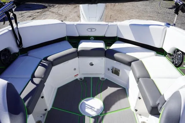 Slide: The Image of 2024 Tahoe 210 S boat interior with cushioned seating and modern design. - 18