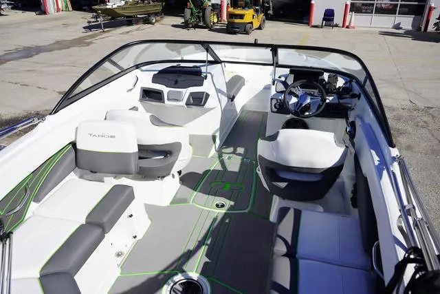Slide: The Image of 2024 Tahoe 210 S boat interior with modern seating and steering wheel. - 5