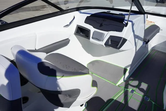 Slide: The Image of 2024 Tahoe 210 S boat interior with modern seating and dashboard design. - 7
