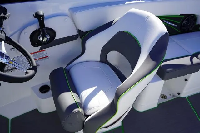 Slide: The Image of 2024 Tahoe 210 S boat interior with modern seating and steering controls. - 9