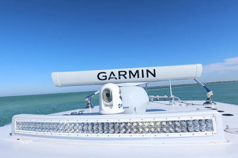 Slide: The Image of SeaVee 370z 2020 boat with Garmin radar and LED light bar on open water. - 14