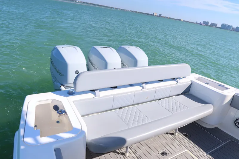 Slide: The Image of 2020 SeaVee 370z boat with triple outboard engines on calm water. - 16