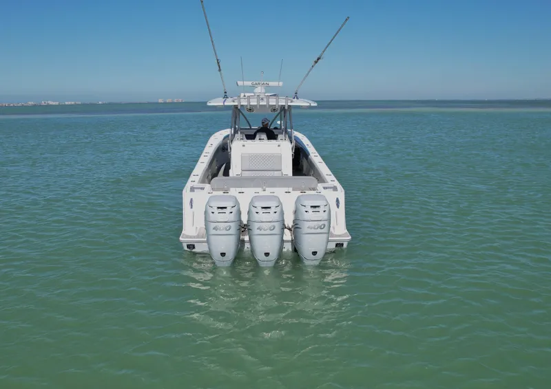 Slide: The Image of 2020 SeaVee 370z boat with triple outboard engines on calm water. - 2