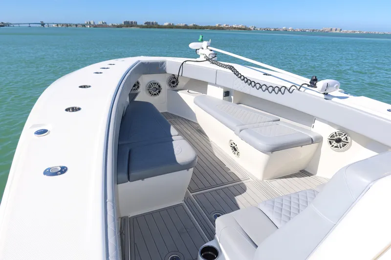 Slide: The Image of 2020 SeaVee 370z boat with spacious seating on calm waters. - 30