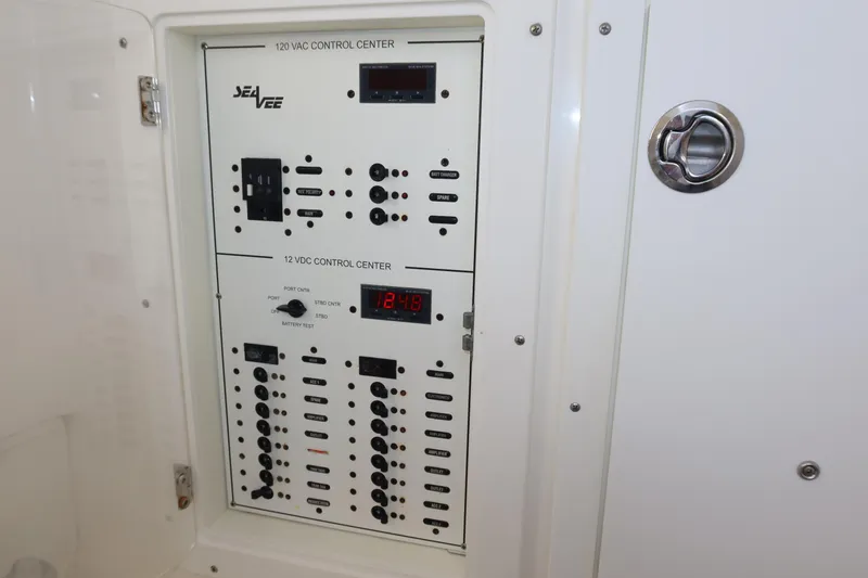 Slide: The Image of Control panel of 2020 SeaVee 370z boat, featuring electrical switches and displays. - 32