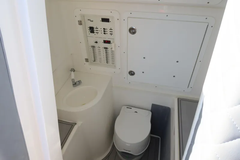 Slide: The Image of 2020 SeaVee 370z boat bathroom with sink, toilet, and control panel. - 35