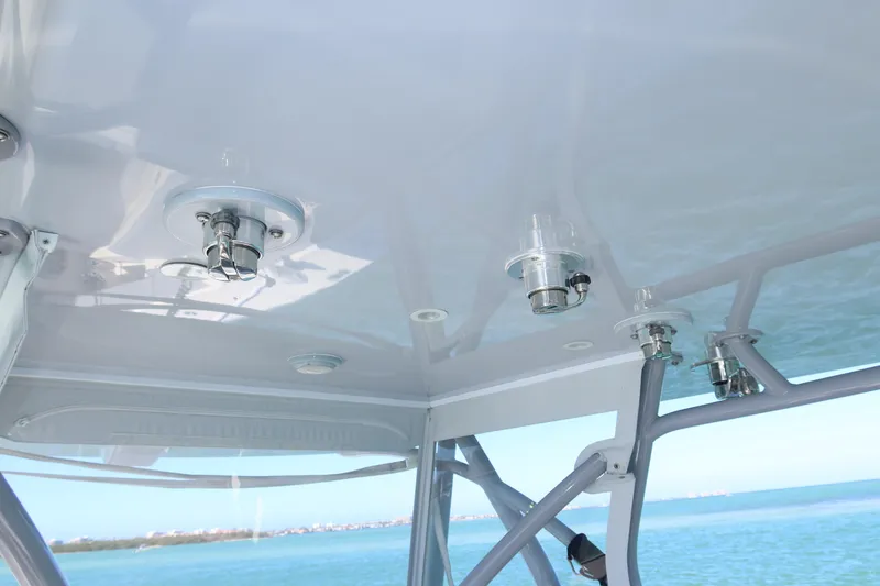 Slide: The Image of 2020 SeaVee 370z boat canopy with mounted fixtures, overlooking the ocean. - 36