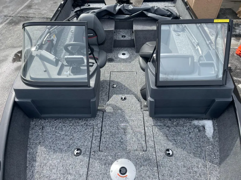 Slide: The Image of 2025 Tracker Pro Guide V-175 Combo boat interior with dual consoles and seating. - 4