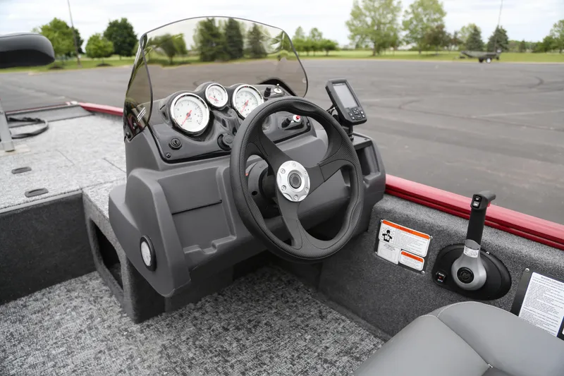 Slide: The Image of 2025 Tracker Pro 170 boat dashboard with steering wheel and gauges. - 4