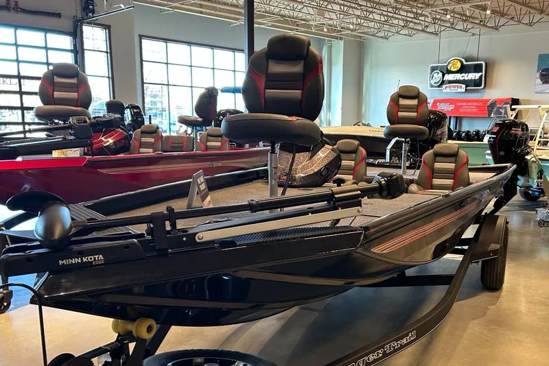 The Image of 2025 Ranger RT188 boat displayed outside Tracker Boats & ATVs store. - 0