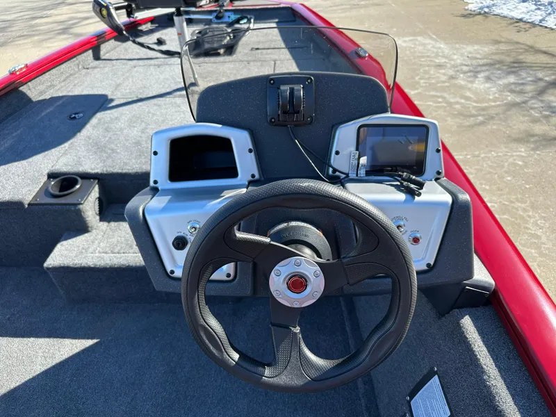 Slide: The Image of 2025 Tracker Pro Team 175 boat dashboard with steering wheel and electronic displays. - 5