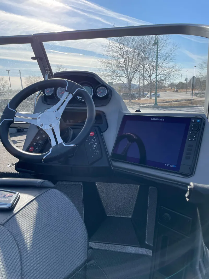 Slide: The Image of 2024 Ranger 621FS Ranger Cup boat dashboard with steering wheel and navigation display. - 3