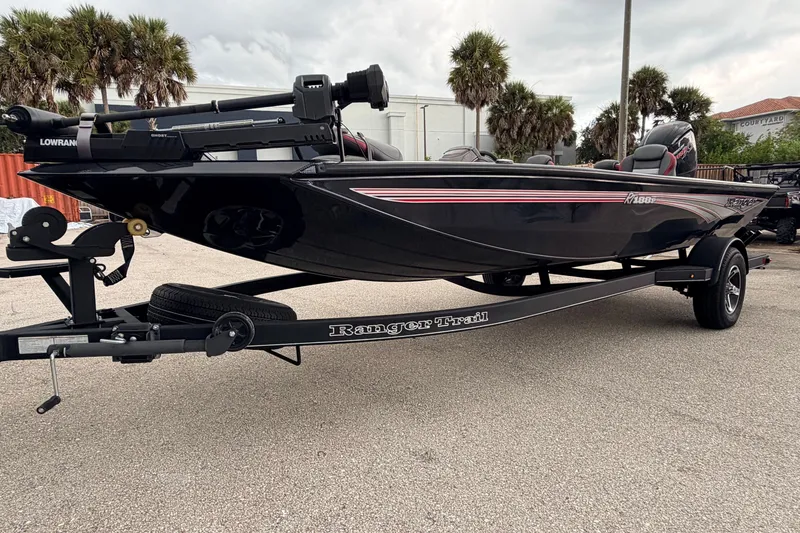 The Image of 2025 Ranger RT188P boat on trailer, sleek black design, parked outdoors. - 0