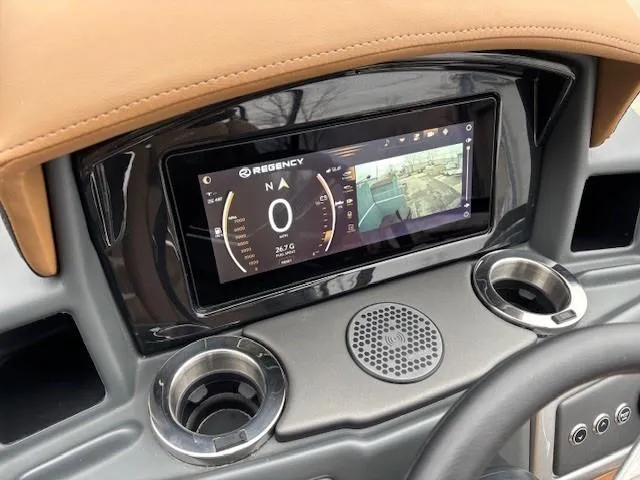 Slide: The Image of Dashboard of 2024 Regency 250 LE3 Sport with digital display and cup holders. - 20