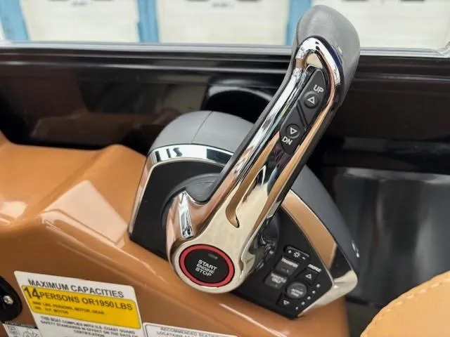 Slide: The Image of 2024 Regency 250 LE3 Sport throttle control with start button and capacity label. - 22