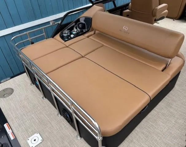 Slide: The Image of 2024 Regency 250 LE3 Sport boat with tan seating and sleek design. - 28