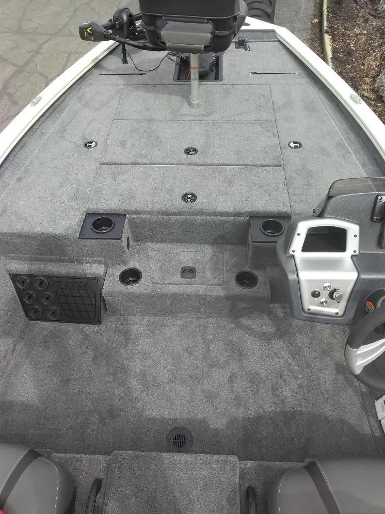 Slide: The Image of 2025 Tracker Pro Team 195 Tournament Edition boat interior with gray carpet and control panel. - 3