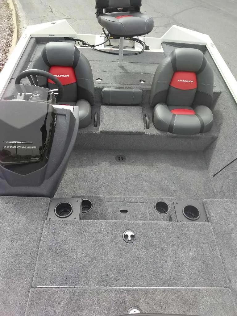 Slide: The Image of 2025 Tracker Pro Team 195 Tournament Edition boat interior with seating and steering console. - 4
