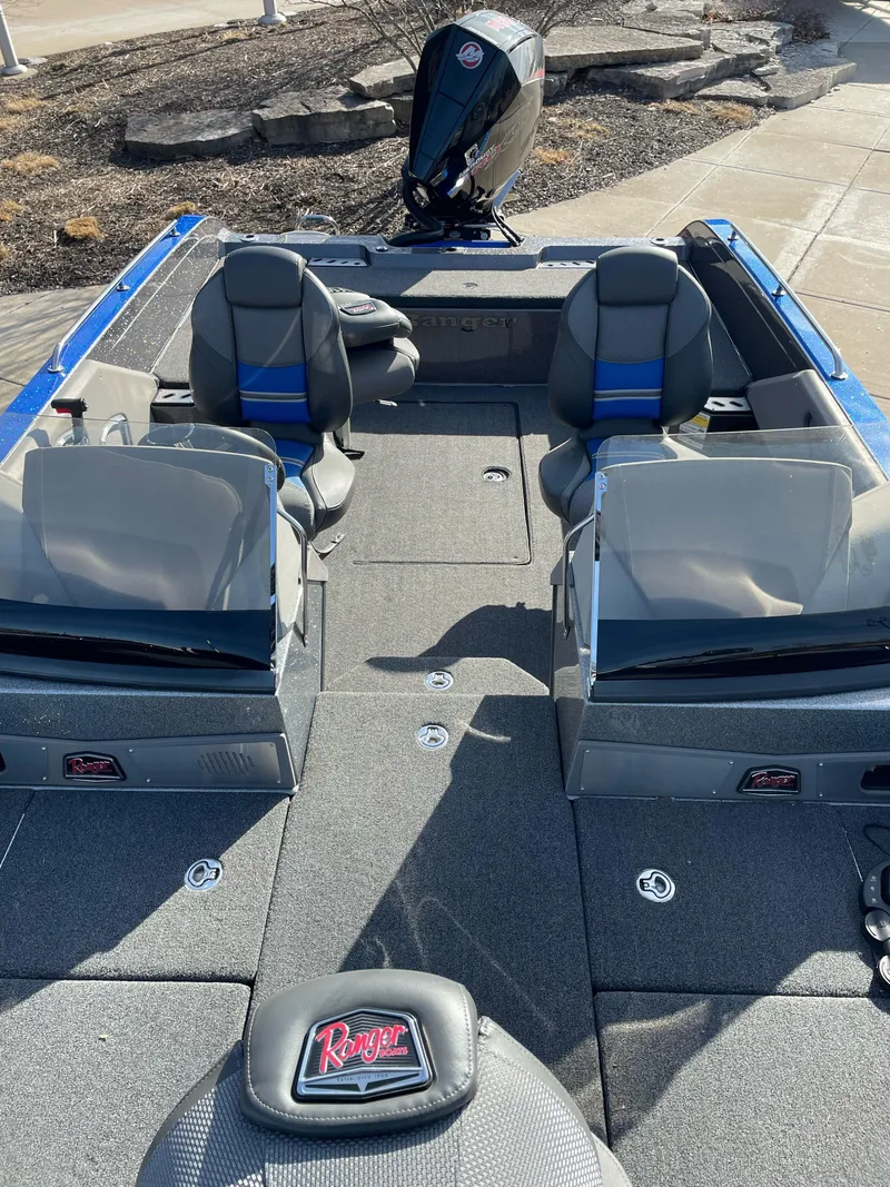 Slide: The Image of 2024 Ranger 620FS Pro boat interior with seating and motor, showcasing modern design. - 4