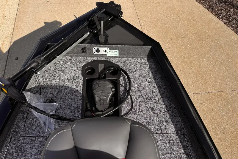 Slide: The Image of 2025 Tracker Pro Team 175 boat interior with steering controls and seating. - 3