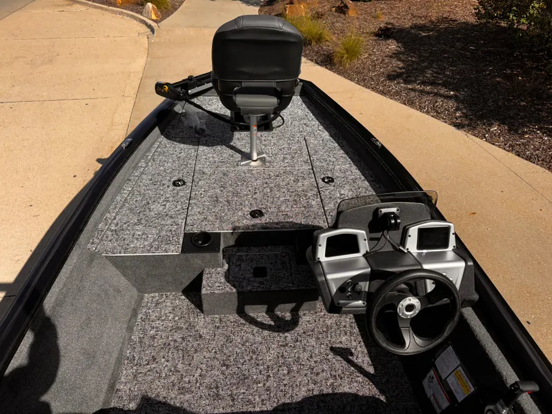 Slide: The Image of 2025 Tracker Pro Team 175 boat interior with steering wheel and seating. - 4