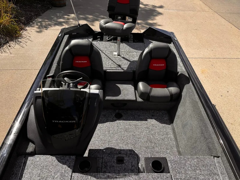 Slide: The Image of 2025 Tracker Pro Team 175 boat interior with seating and steering console. - 6
