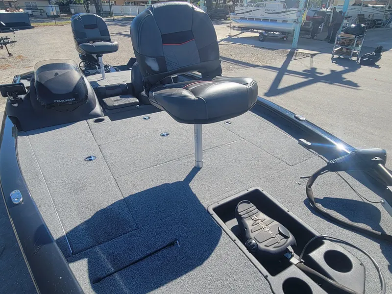 Slide: The Image of 2021 Tracker Pro Team 195 TXW fishing boat with seating and storage compartments. - 12