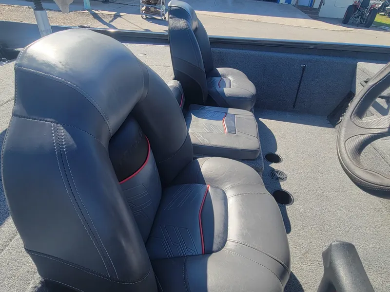 Slide: The Image of 2021 Tracker Pro Team 195 TXW boat interior with gray leather seats. - 16