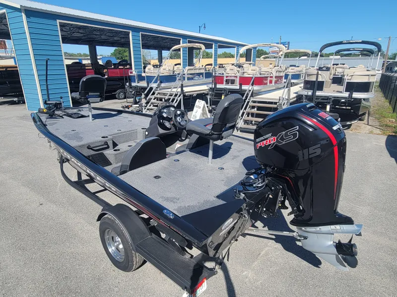 Slide: The Image of 2021 Tracker Pro Team 195 TXW boat with Mercury 115 Pro XS engine in a marina. - 6