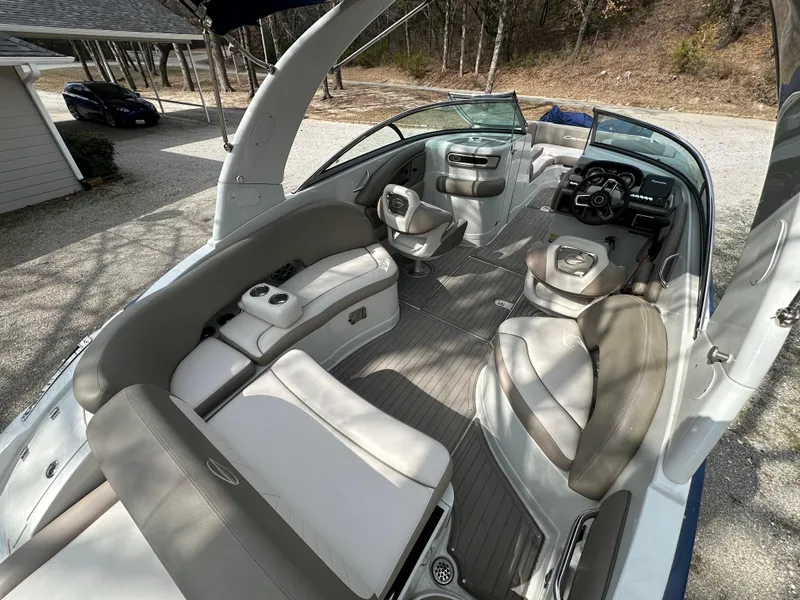 Slide: The Image of 2018 Crownline Eclipse E25 boat interior with spacious seating and modern dashboard. - 3