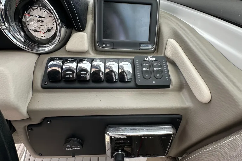 Slide: The Image of Control panel of 2018 Crownline Eclipse E25 boat with gauges and switches. - 30